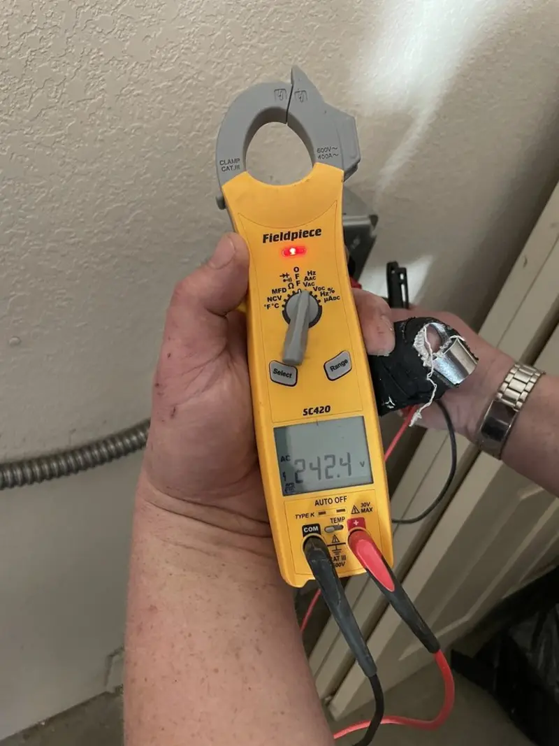 Voltage testing with clamp meter during Electrical Installation Services in Saratoga Springs